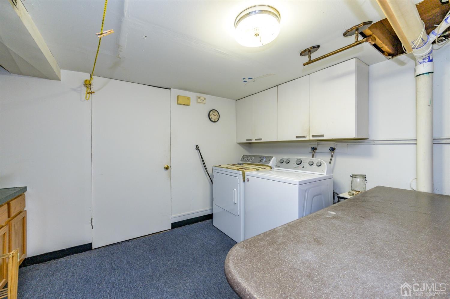 456 Dover Road Toms River, NJ 08757 - Photo 22 of 39 a view of a storage & utility room with washer and dryer