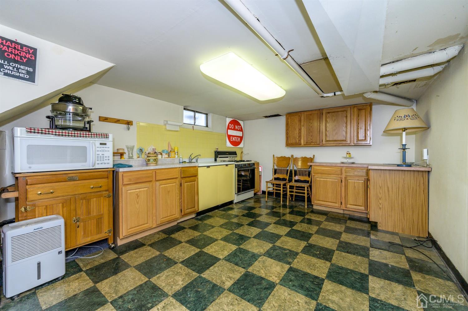 456 Dover Road Toms River, NJ 08757 - Photo 23 of 39 a kitchen with a cabinets and appliances