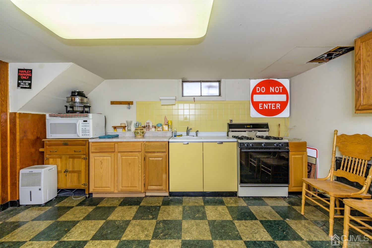 456 Dover Road Toms River, NJ 08757 - Photo 24 of 39 a kitchen with stainless steel appliances a stove a sink and a refrigerator