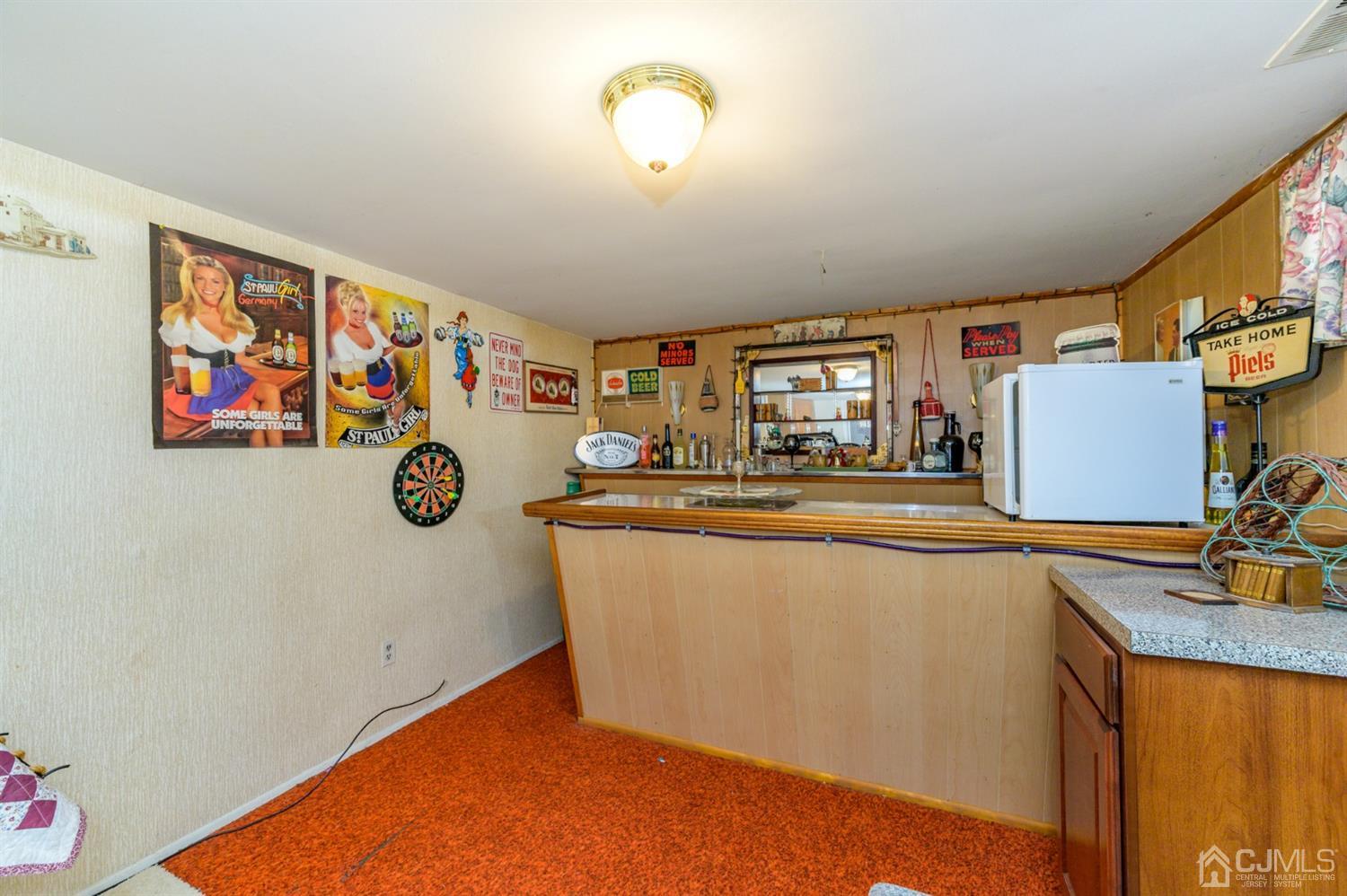 456 Dover Road Toms River, NJ 08757 - Photo 27 of 39 a room with furniture and a flat screen tv