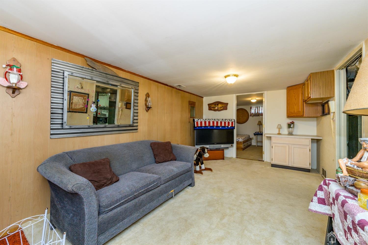 456 Dover Road Toms River, NJ 08757 - Photo 28 of 39 a living room with furniture and a flat screen tv