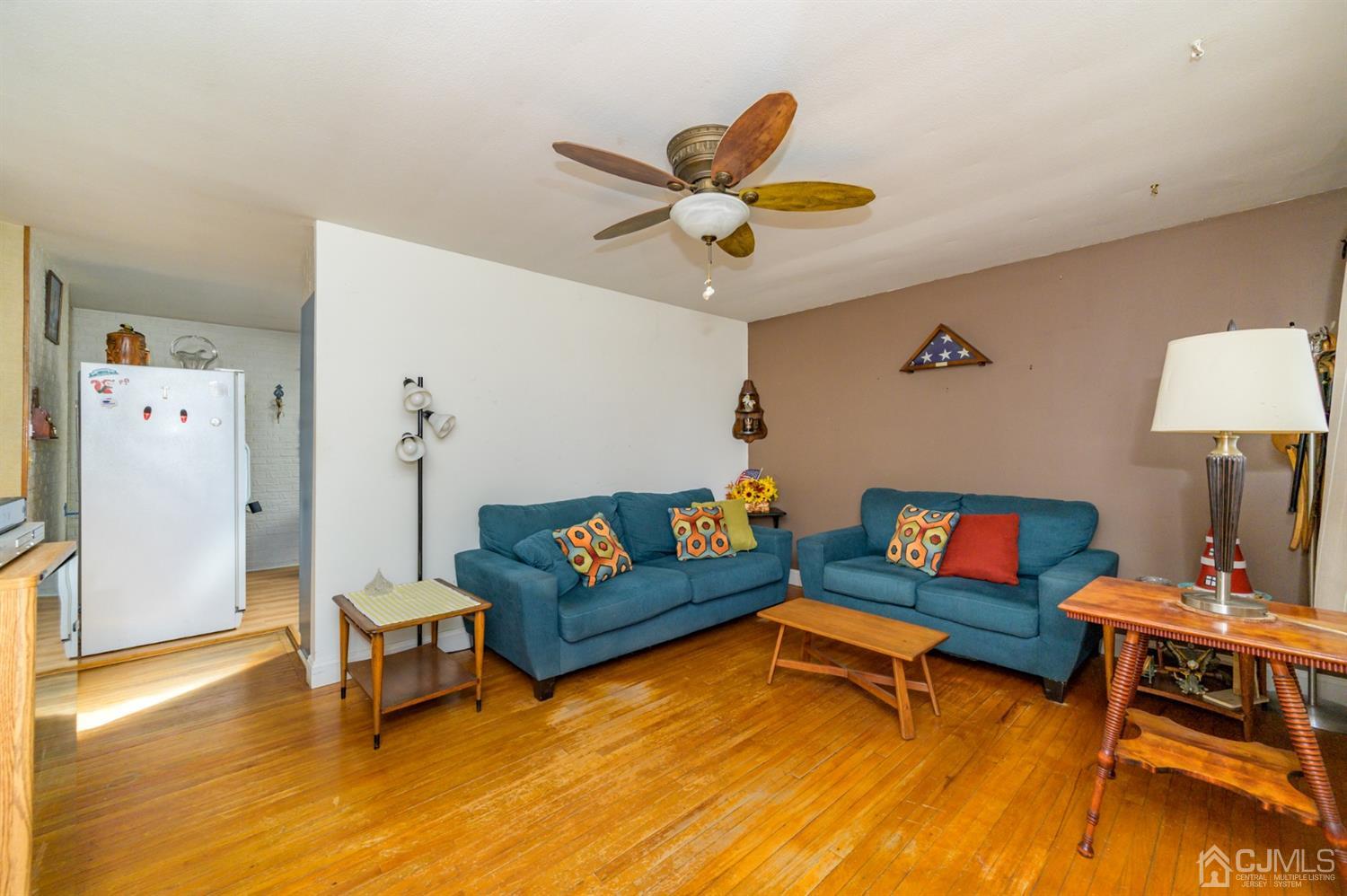 456 Dover Road Toms River, NJ 08757 - Photo 4 of 39 a living room with furniture and a table