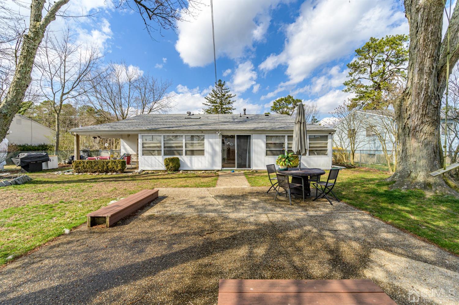 456 Dover Road Toms River, NJ 08757 - Photo 37 of 39 a view of a house with swimming pool and sitting area