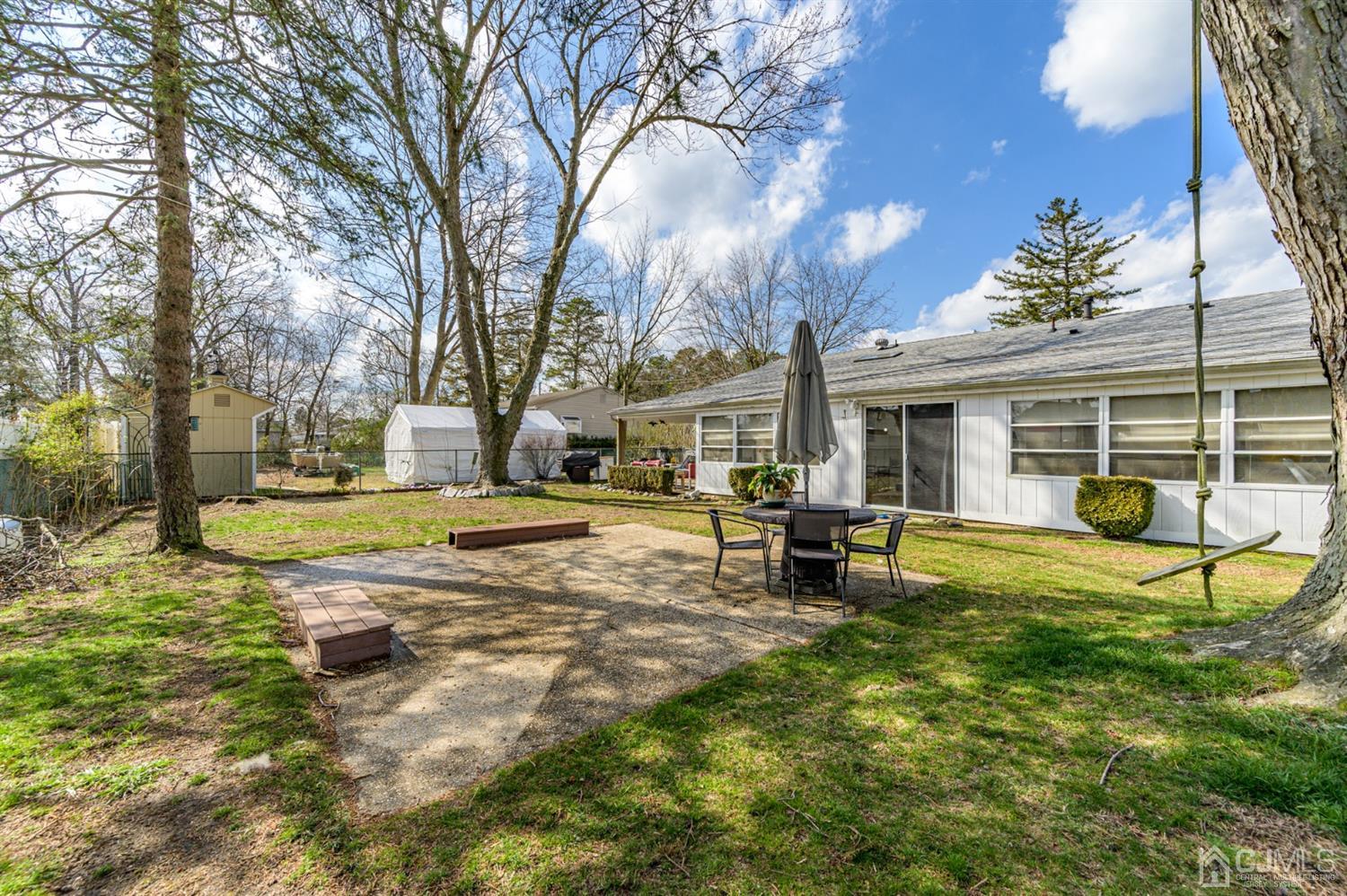 456 Dover Road Toms River, NJ 08757 - Photo 38 of 39 a view of a house with backyard porch and sitting area