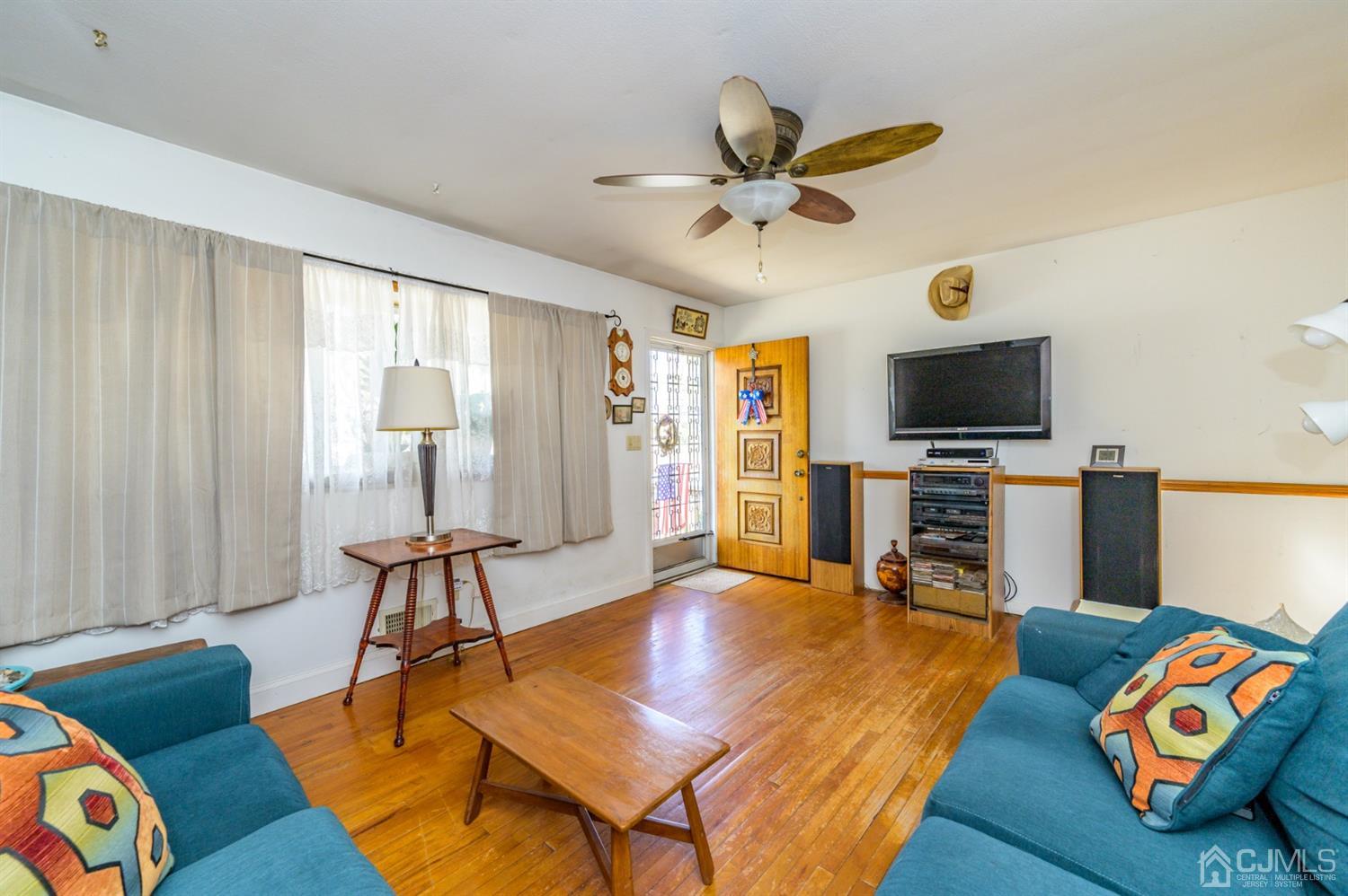 456 Dover Road Toms River, NJ 08757 - Photo 7 of 39 a living room with furniture and a flat screen tv