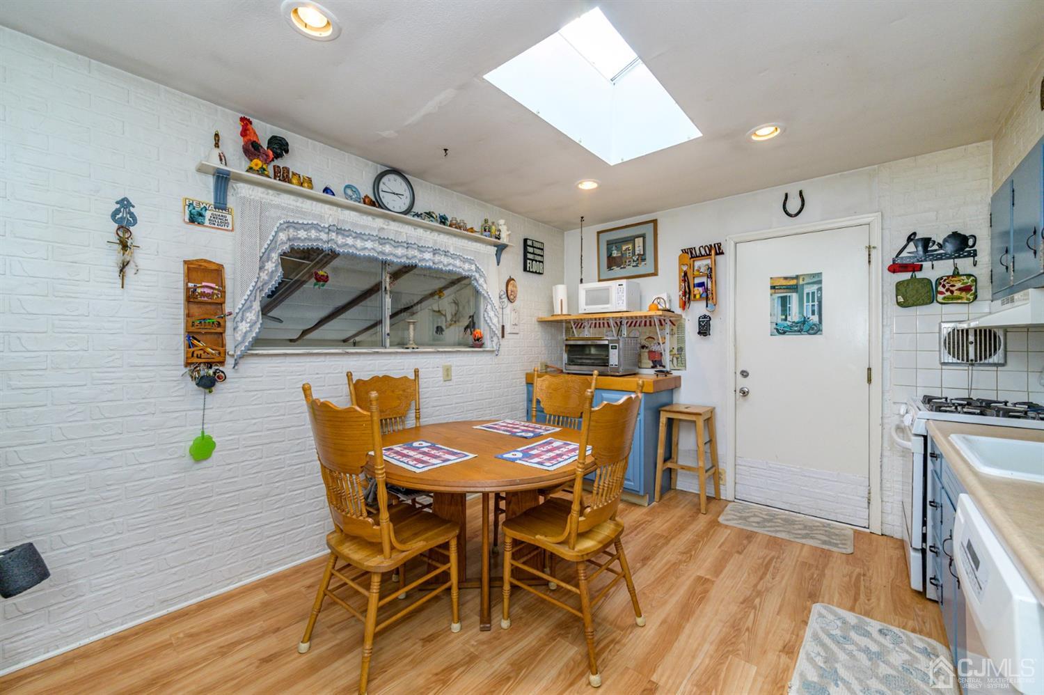 456 Dover Road Toms River, NJ 08757 - Photo 9 of 39 a dining room with furniture and wooden floor
