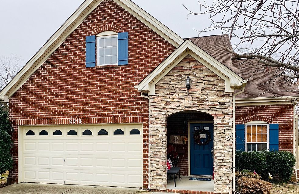a view of a house with a garage