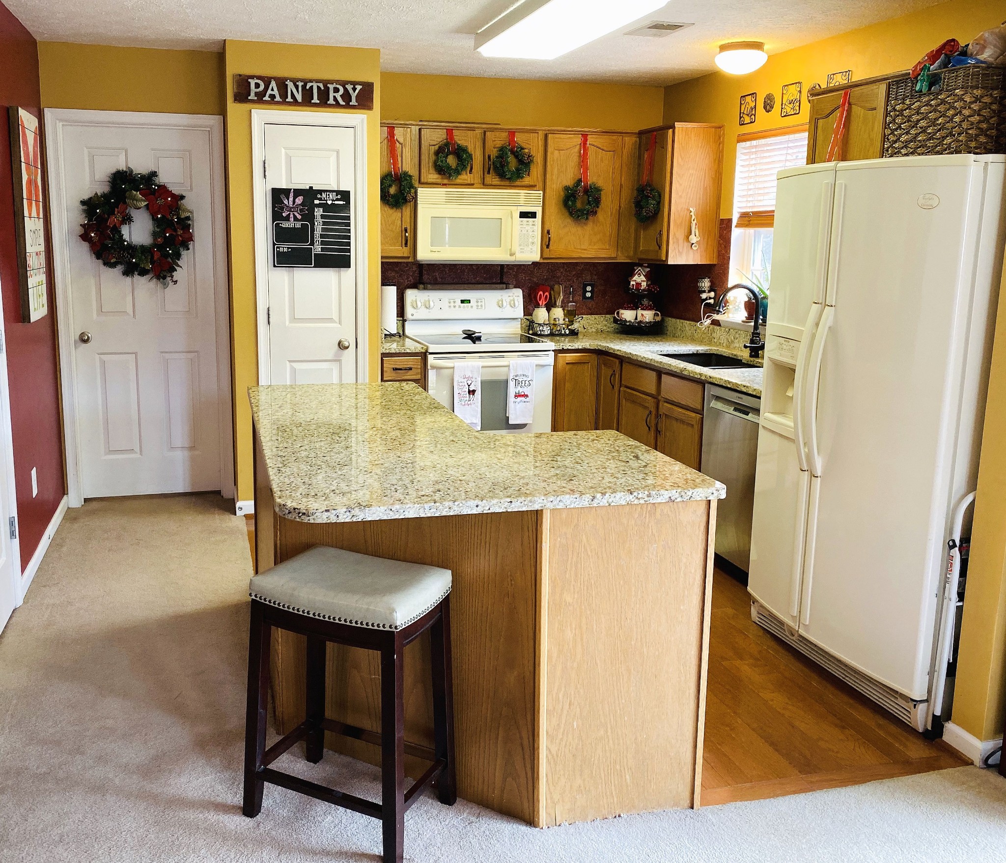 2012 McCrory Place Spring Hill, TN 37174 - Photo 5 of 18 a kitchen with stainless steel appliances granite countertop a refrigerator a stove and a refrigerator
