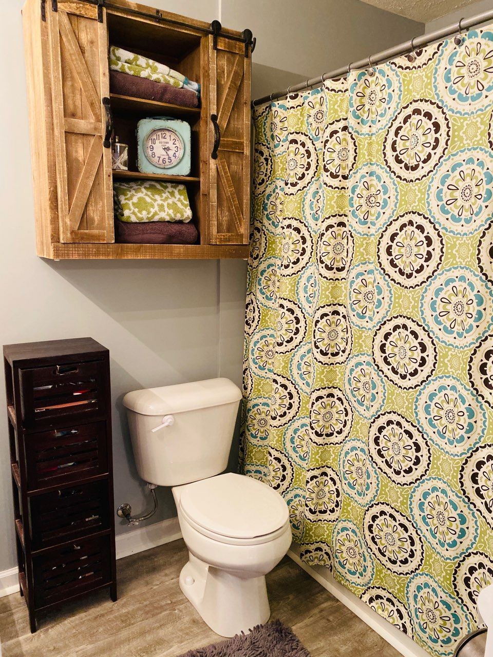 2012 McCrory Place Spring Hill, TN 37174 - Photo 9 of 18 a bathroom with a toilet and a shower curtain
