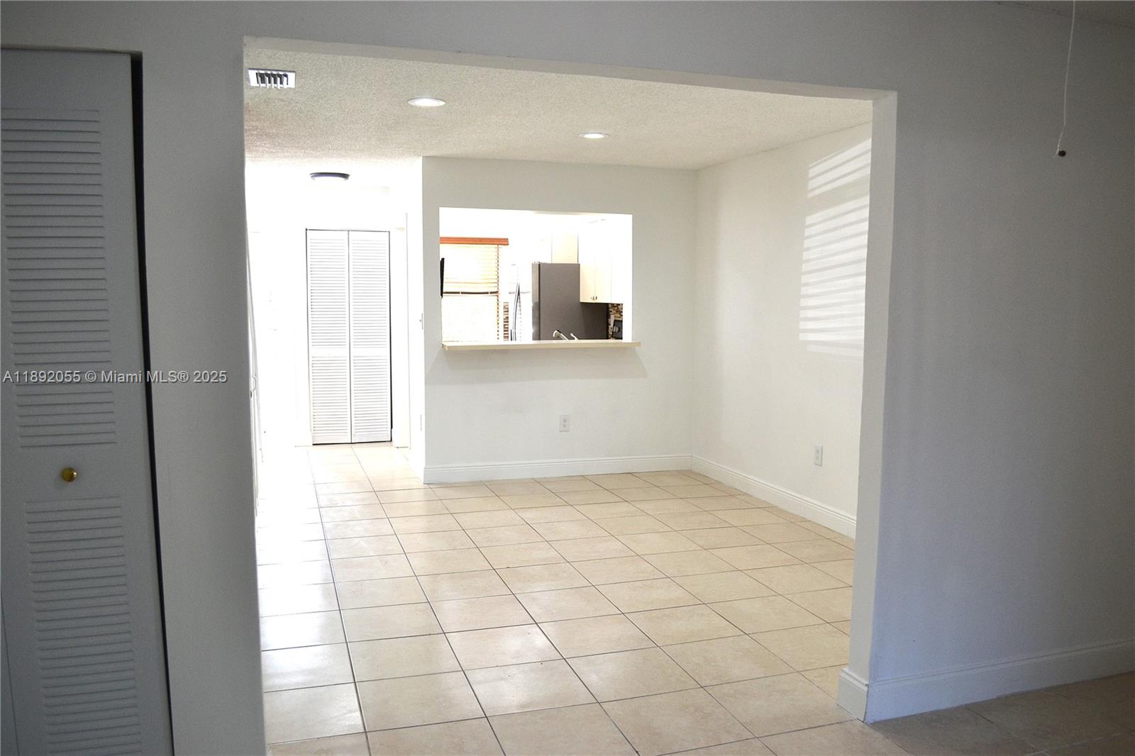 6475 Southwest 129th Place, Unit 4094 Miami, FL 33183 - Photo 6 of 20 a view of a hallway to rooms and natural light