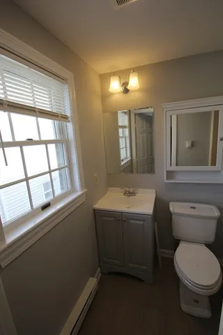 a bathroom with a shower and a toilet