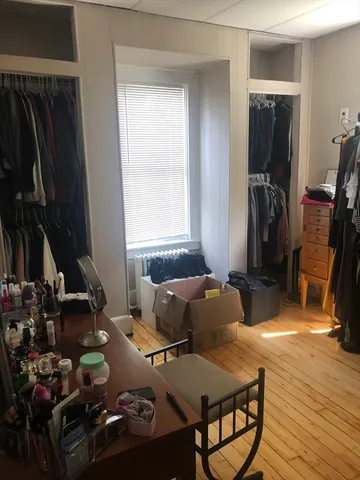 a room with furniture and wooden floor