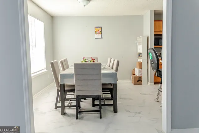 a view of a dining room with furniture