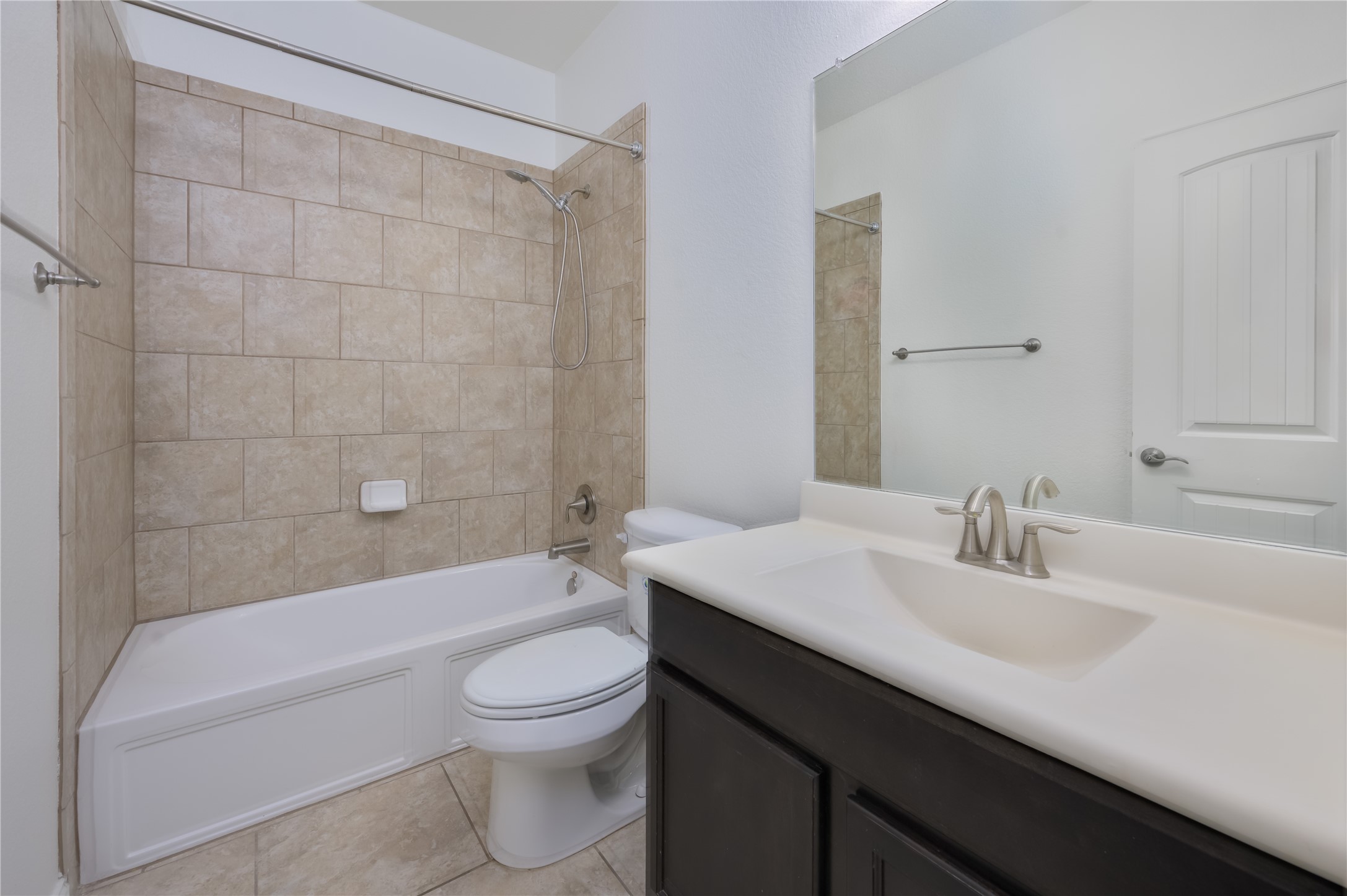 509 Nogales Lane Leander, TX 78641 - Photo 15 of 16 Full bathroom with vanity, shower combination, and light tile patterned floors