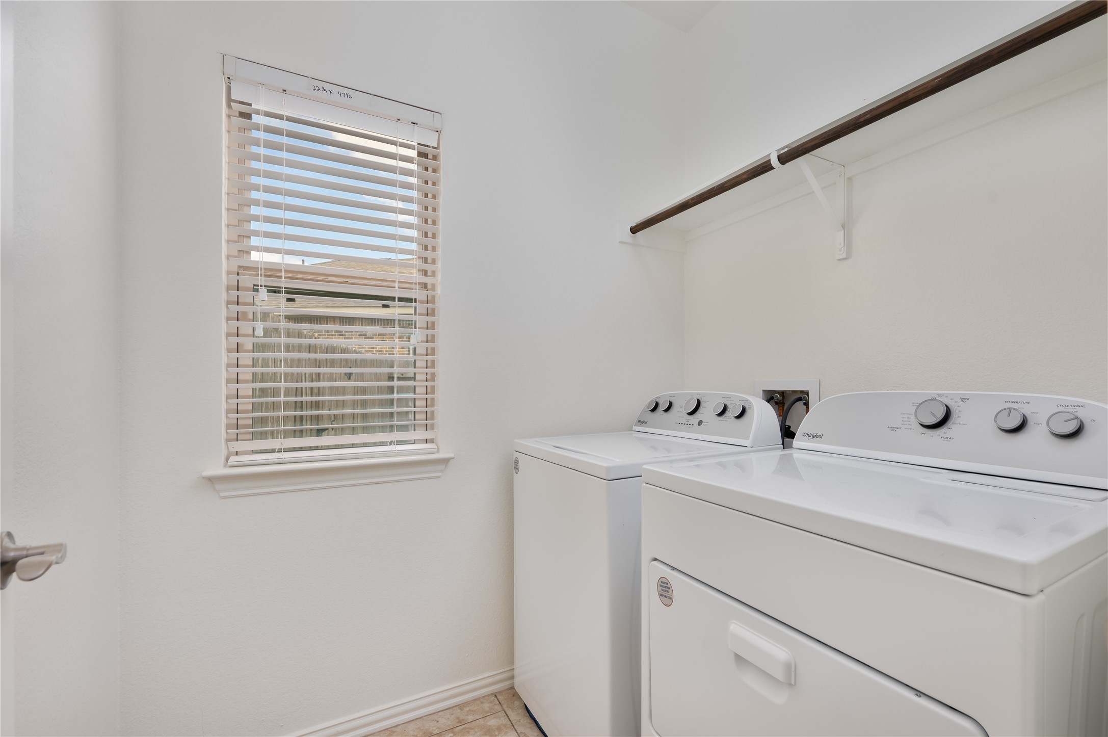 509 Nogales Lane Leander, TX 78641 - Photo 16 of 16 Laundry area with separate washer and dryer and baseboards