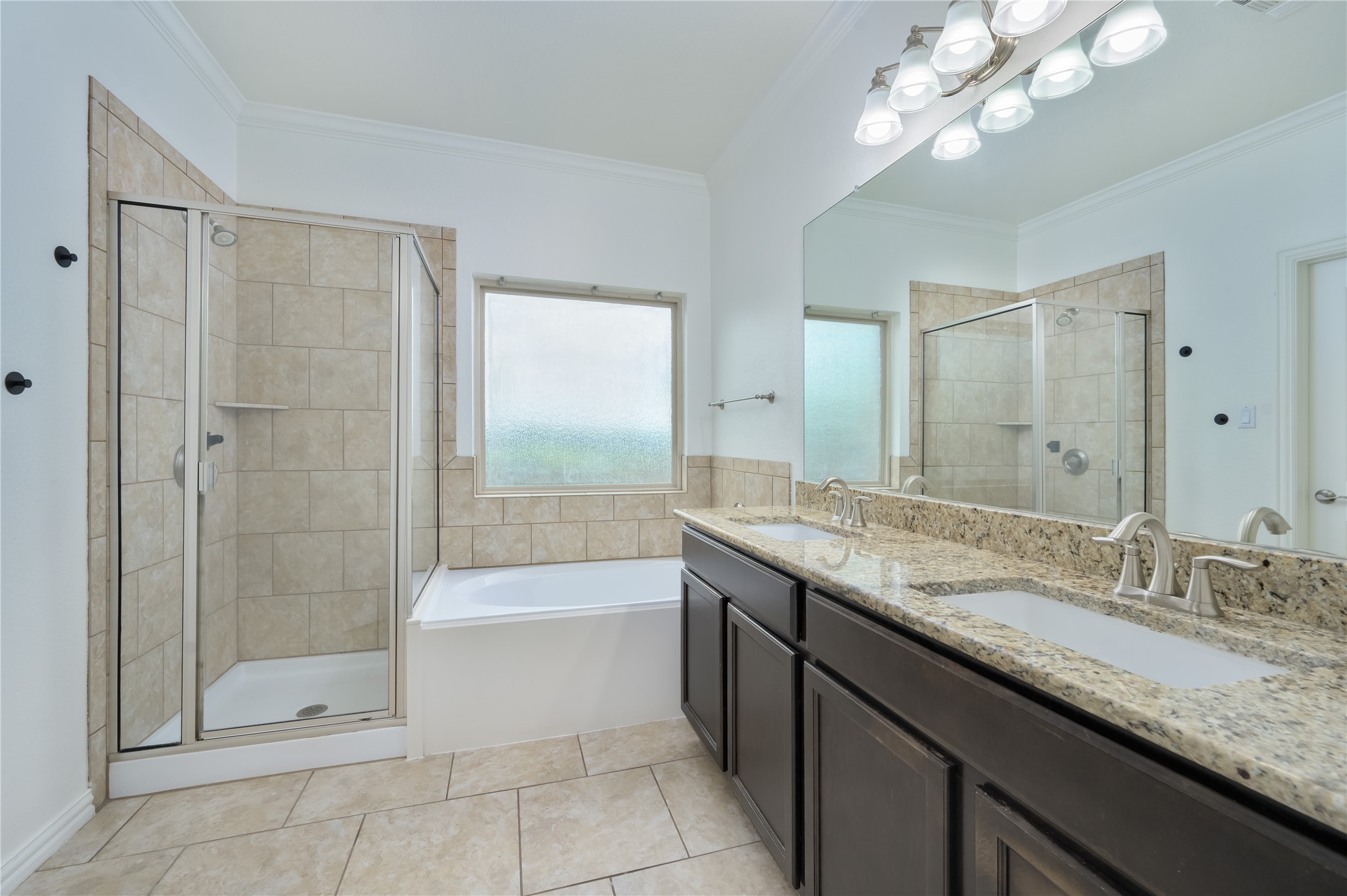 509 Nogales Lane Leander, TX 78641 - Photo 7 of 16 Full bath featuring double vanity, a shower stall and tub
