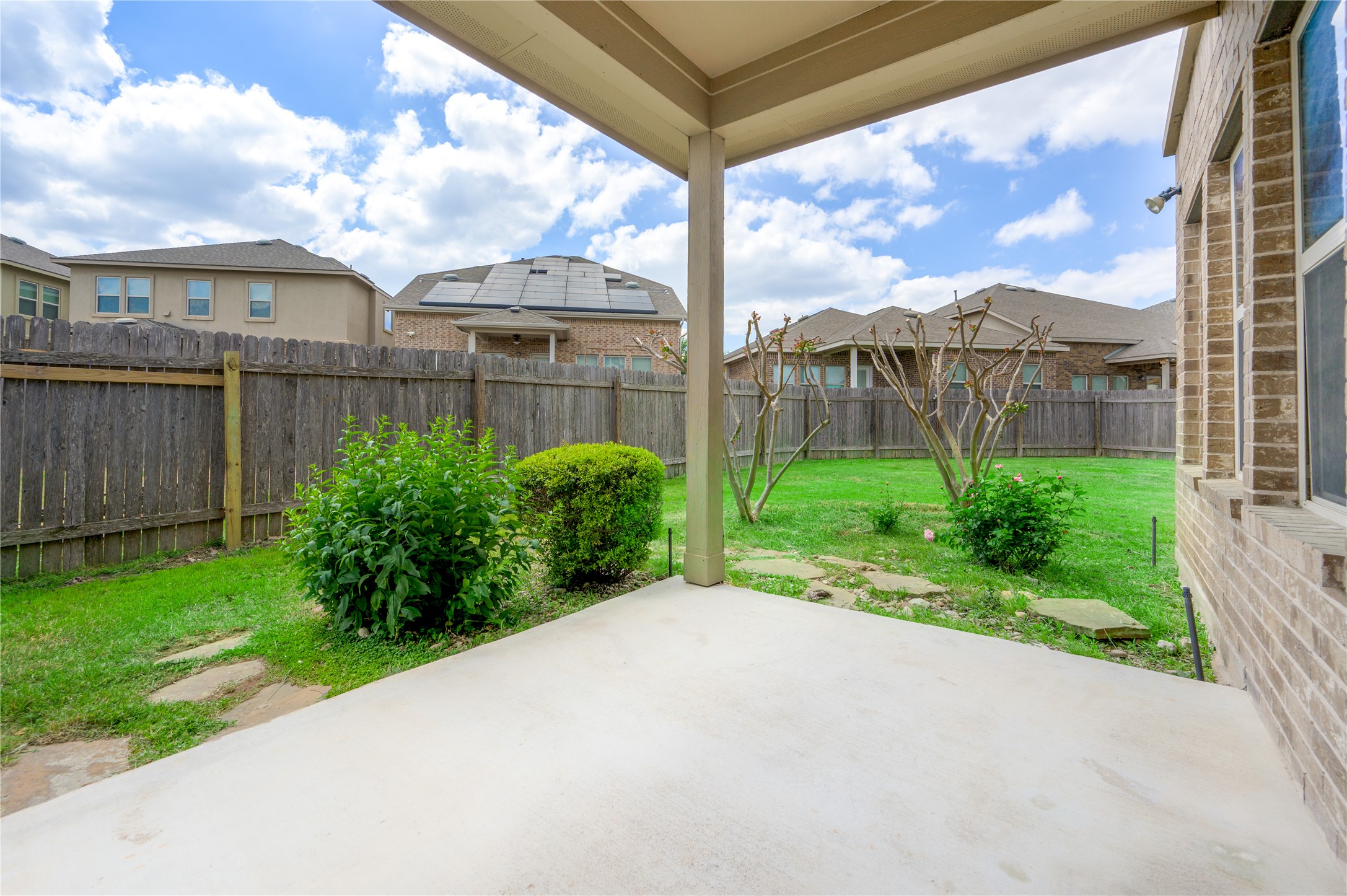 509 Nogales Lane Leander, TX 78641 - Photo 8 of 16 Fenced backyard with a patio opening to large backyard