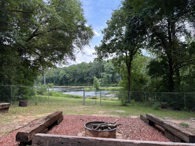 a view of a chairs and table in the balcony
