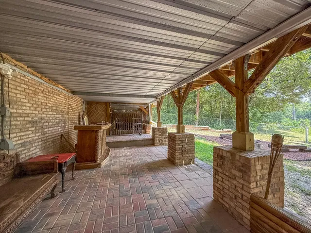 a bedroom with bed and wooden floor