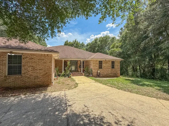 a house with trees in the background