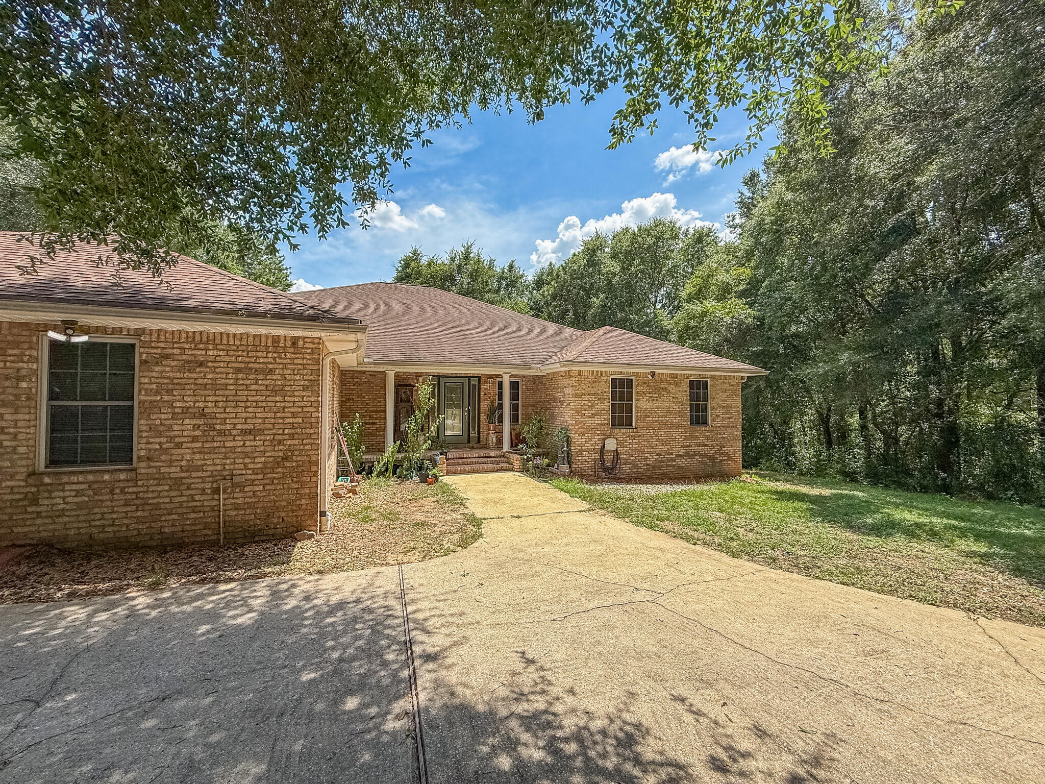 100 Overview Drive Crestview, FL 32539 - Photo 3 of 82 a front view of a house with a yard and garage