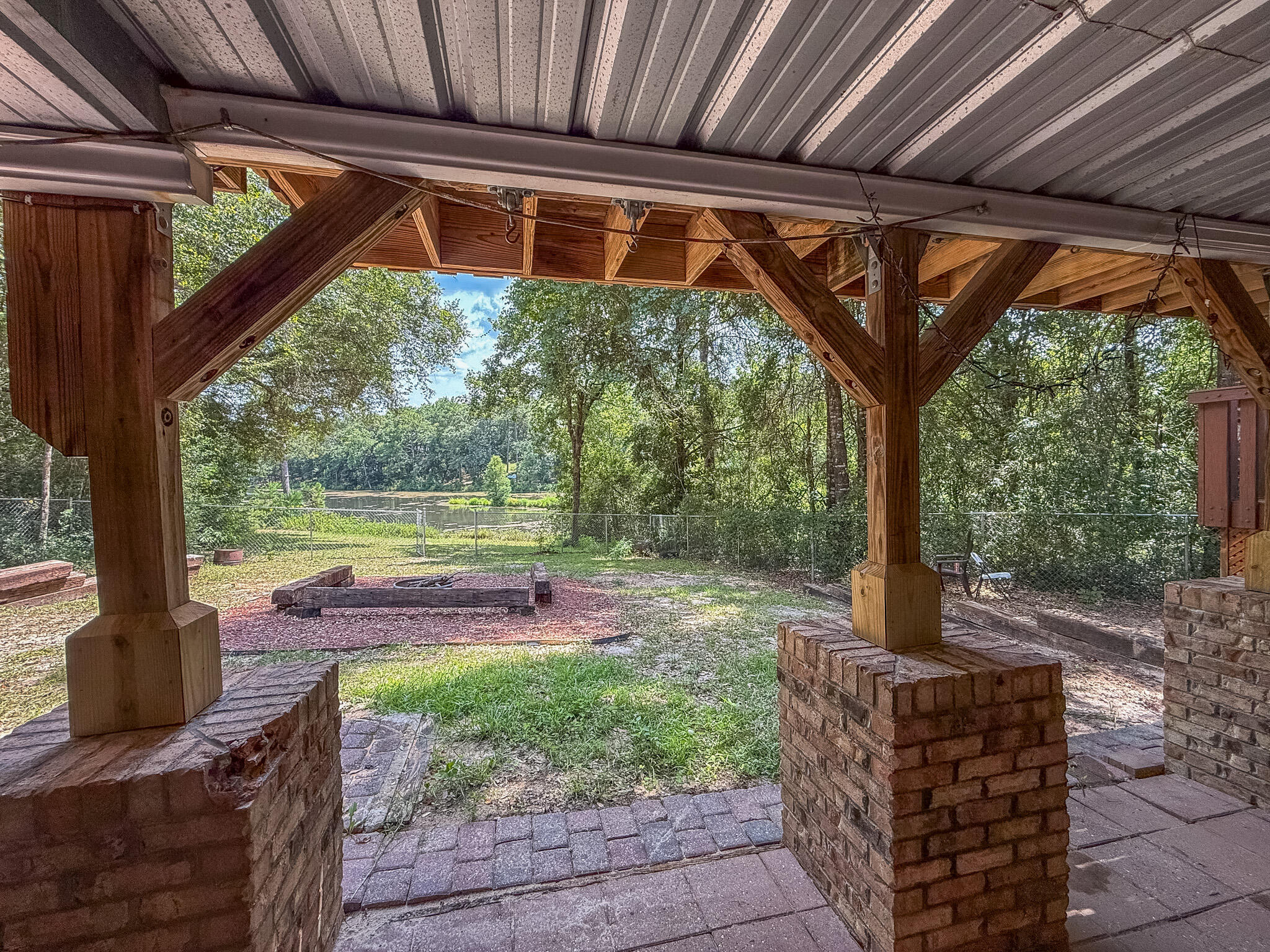 100 Overview Drive Crestview, FL 32539 - Photo 33 of 82 a backyard of a house with garden and outdoor seating