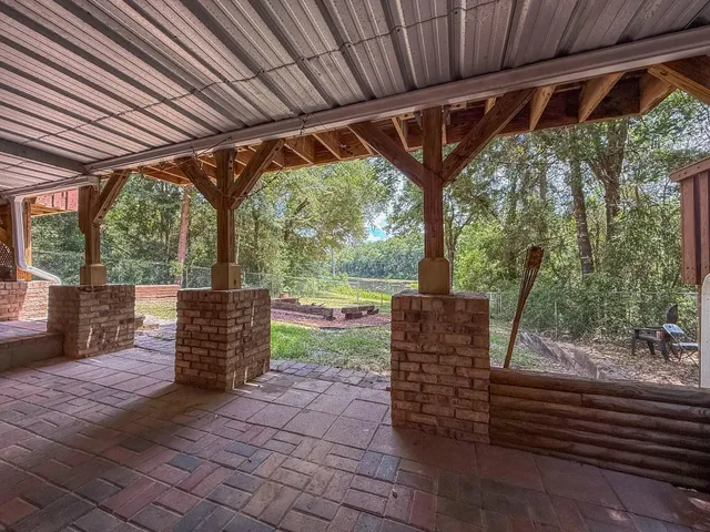 a kitchen with stainless steel appliances kitchen island granite countertop a sink and cabinets