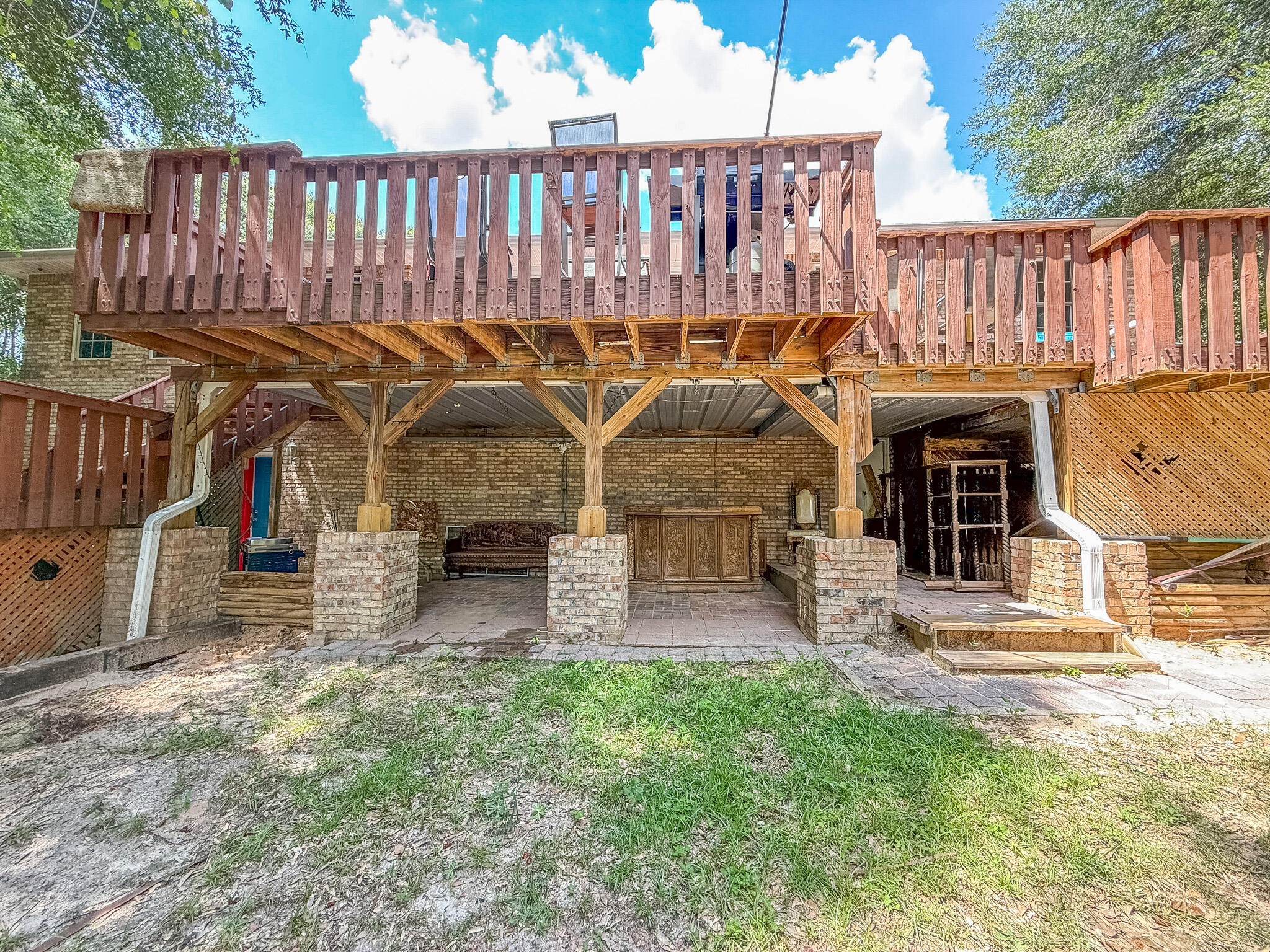 100 Overview Drive Crestview, FL 32539 - Photo 38 of 82 a view of a deck with furniture and garden