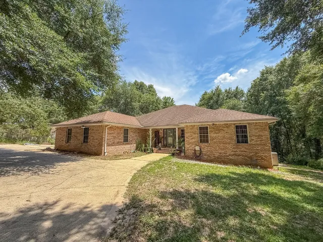 a backyard of a house with lots of green space