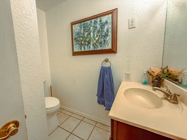 a kitchen with stainless steel appliances kitchen island granite countertop a refrigerator and a stove