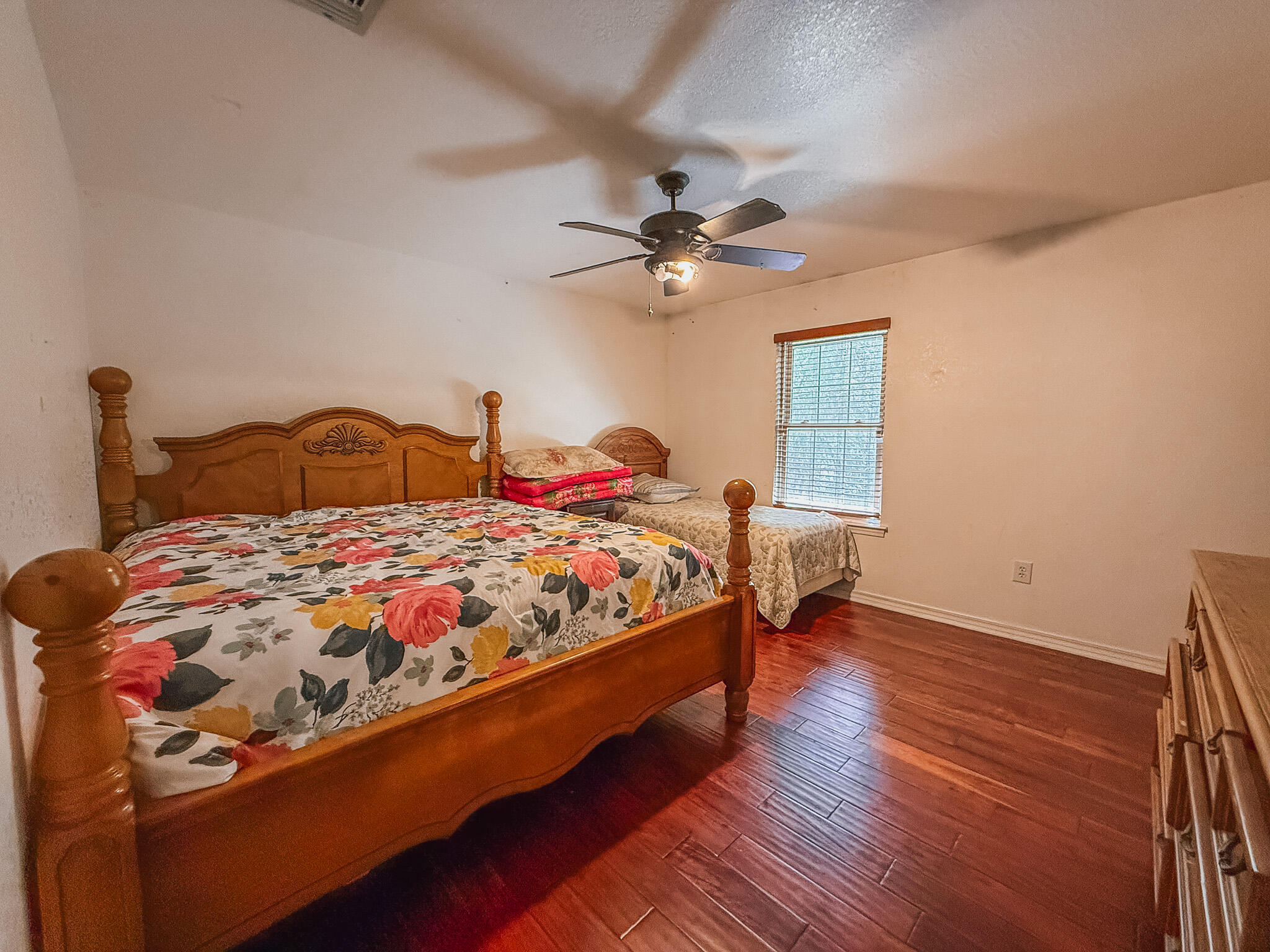100 Overview Drive Crestview, FL 32539 - Photo 47 of 82 a bedroom with a bed a chandelier and a window