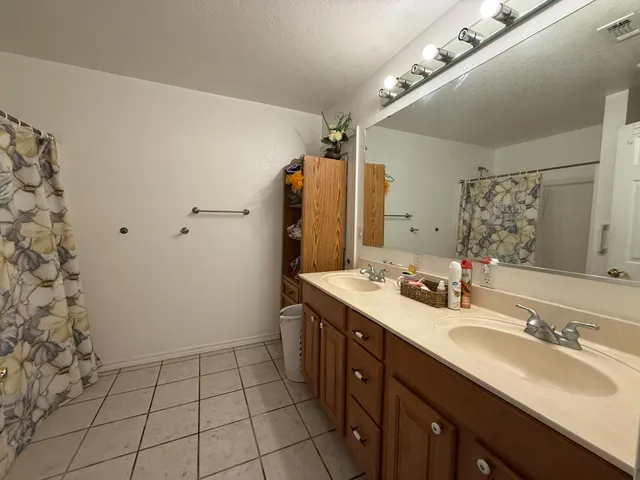 a kitchen with a refrigerator and cabinets