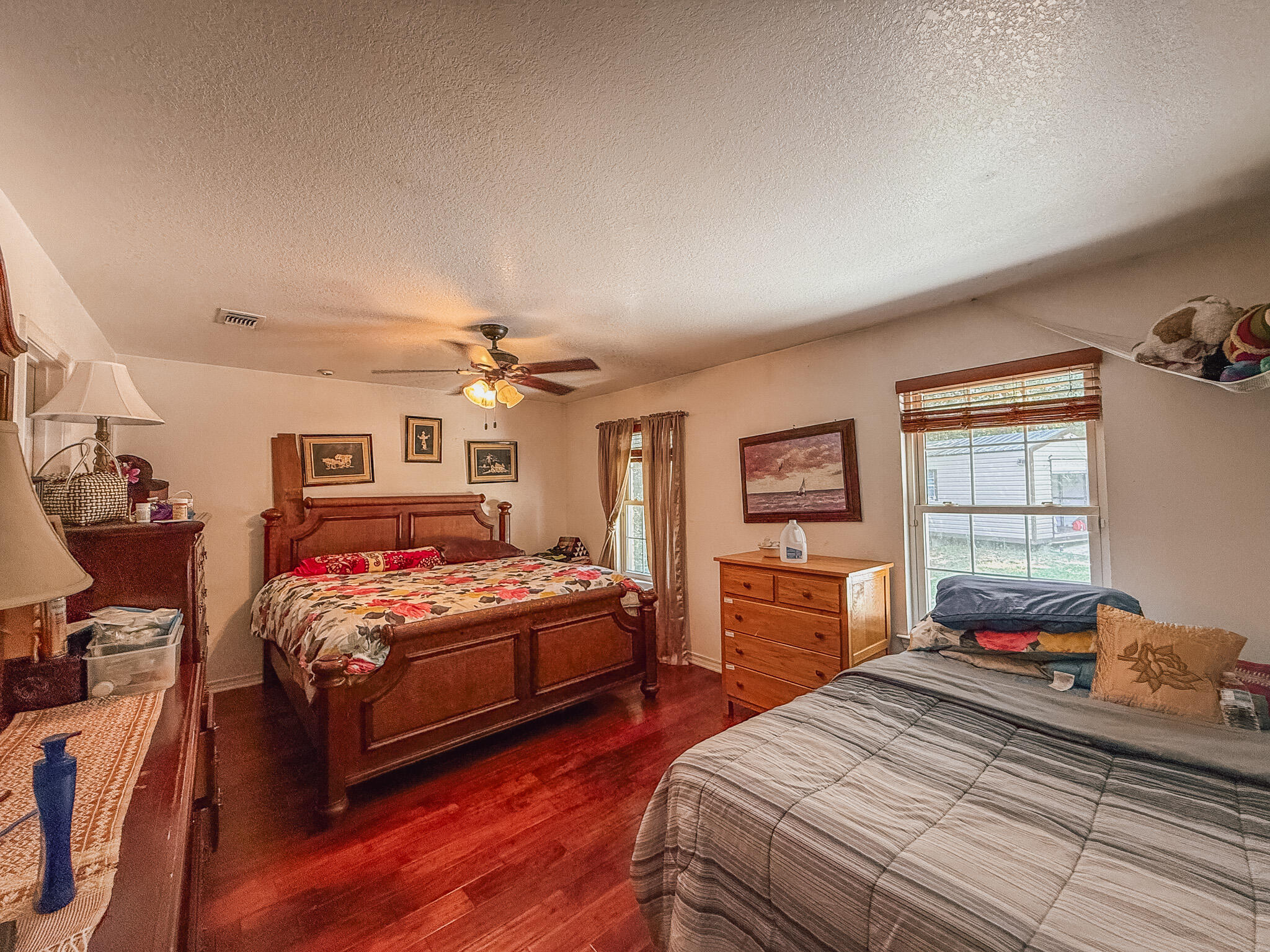 100 Overview Drive Crestview, FL 32539 - Photo 50 of 82 a bedroom with bed and wooden floor