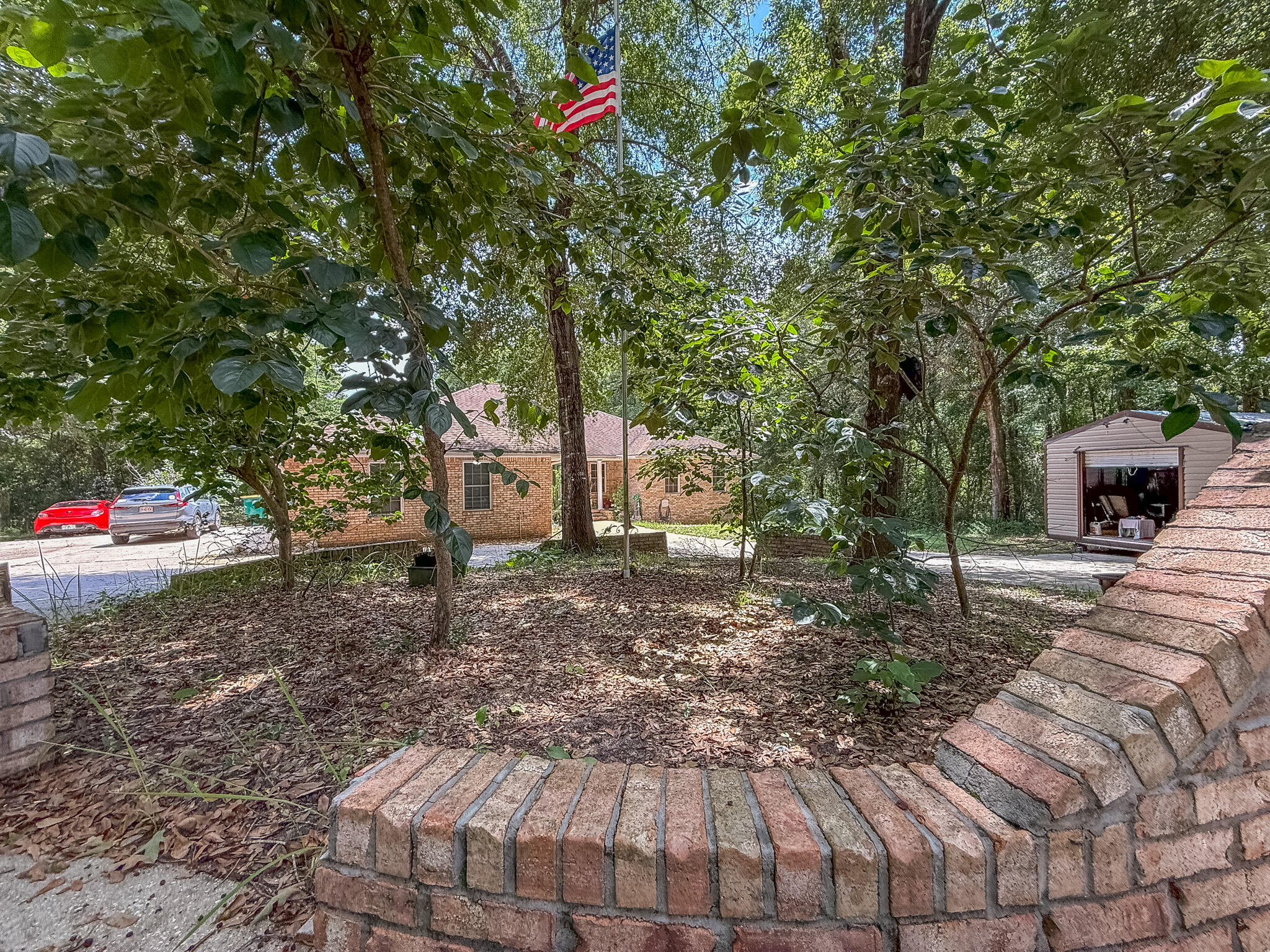 100 Overview Drive Crestview, FL 32539 - Photo 6 of 82 a backyard of a house with lots of green space