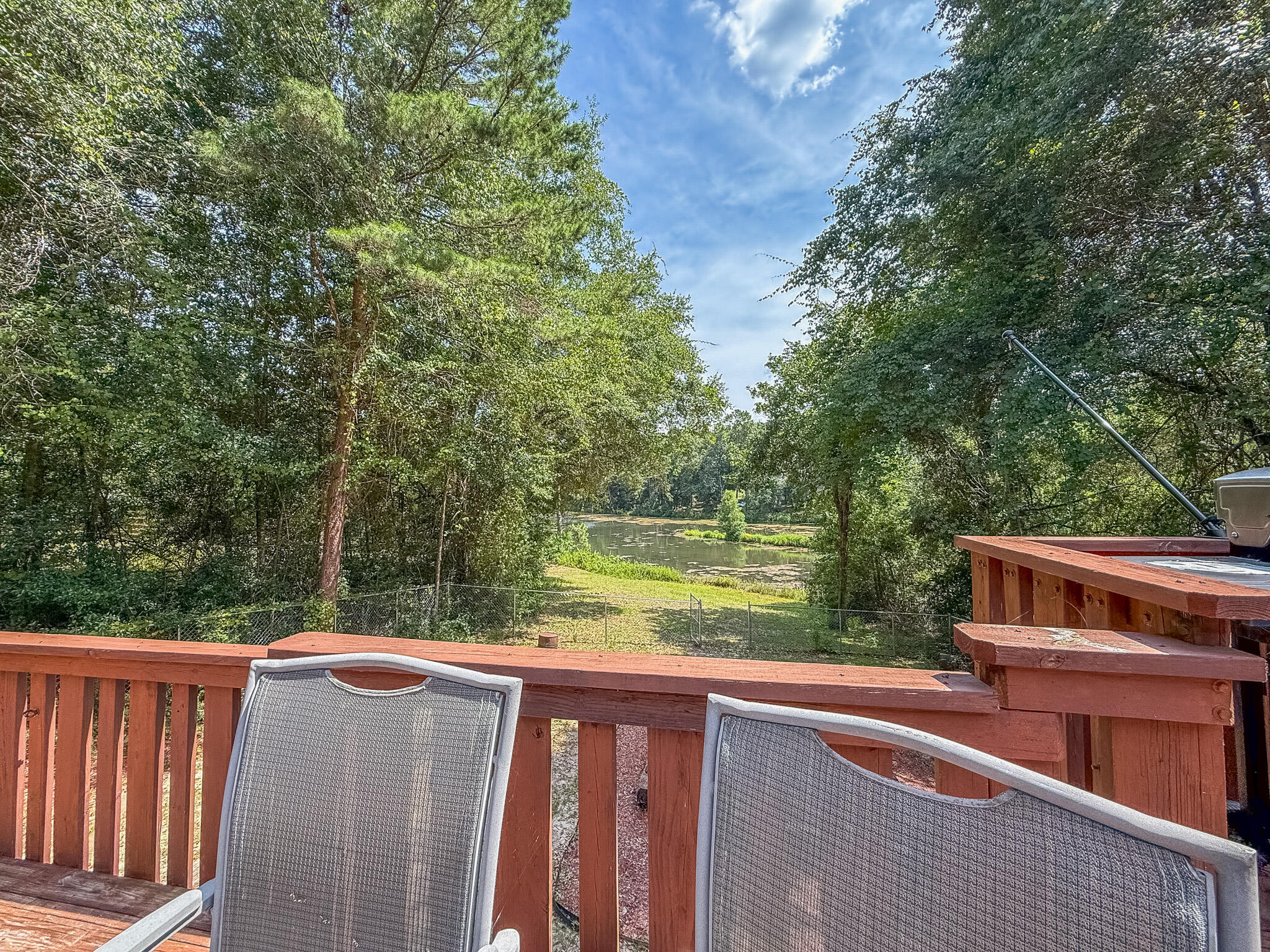 100 Overview Drive Crestview, FL 32539 - Photo 63 of 82 a balcony with wooden floor and yard in the back