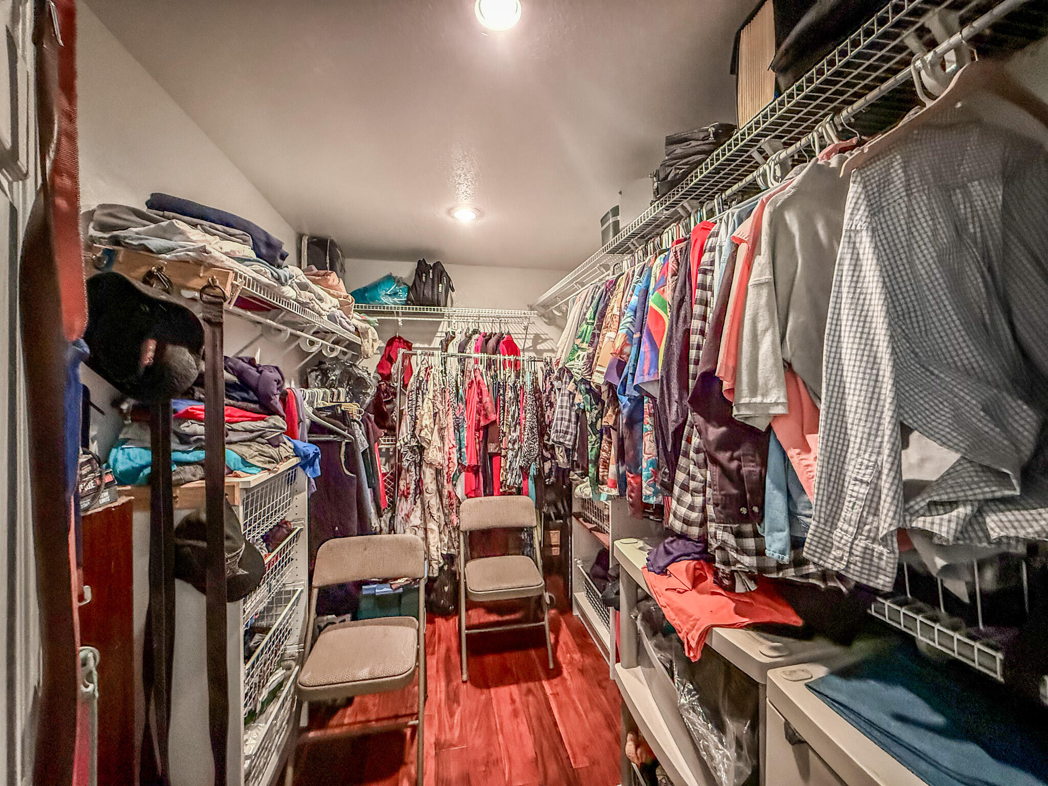 100 Overview Drive Crestview, FL 32539 - Photo 73 of 82 a view of walk in closet with clothes and shoes