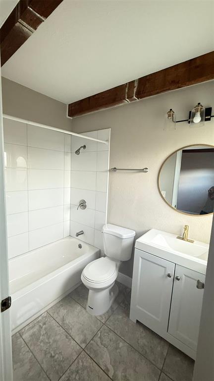 1760 Tee Dee Lane, Unit A Titusville, FL 32780 - Photo 6 of 7 a bathroom with a toilet a sink and bathtub