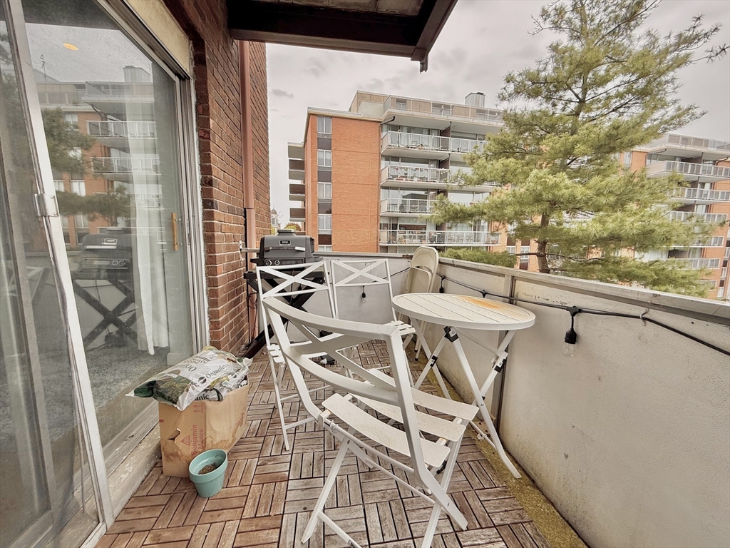 20 Stearns Road, Unit 45 Brookline, MA 02446 - Photo 16 of 22 a view of a balcony with table and chairs