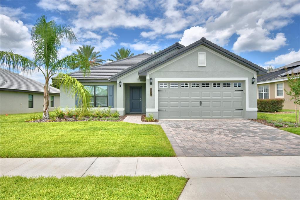 a view of a house with a yard