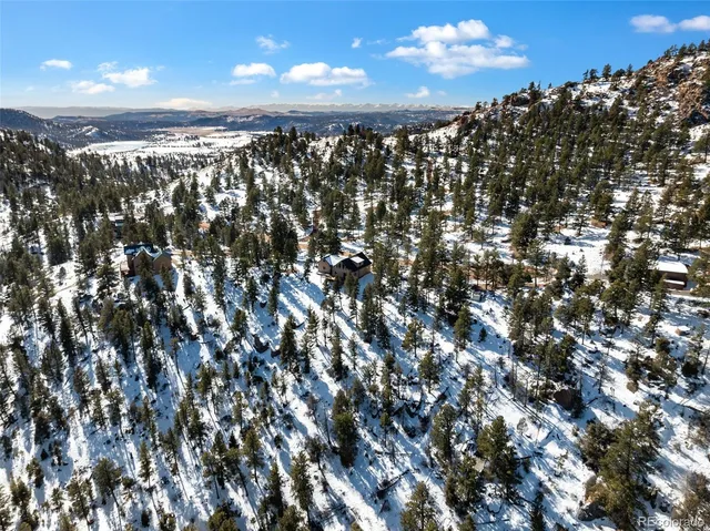 a view of a backyard of the house