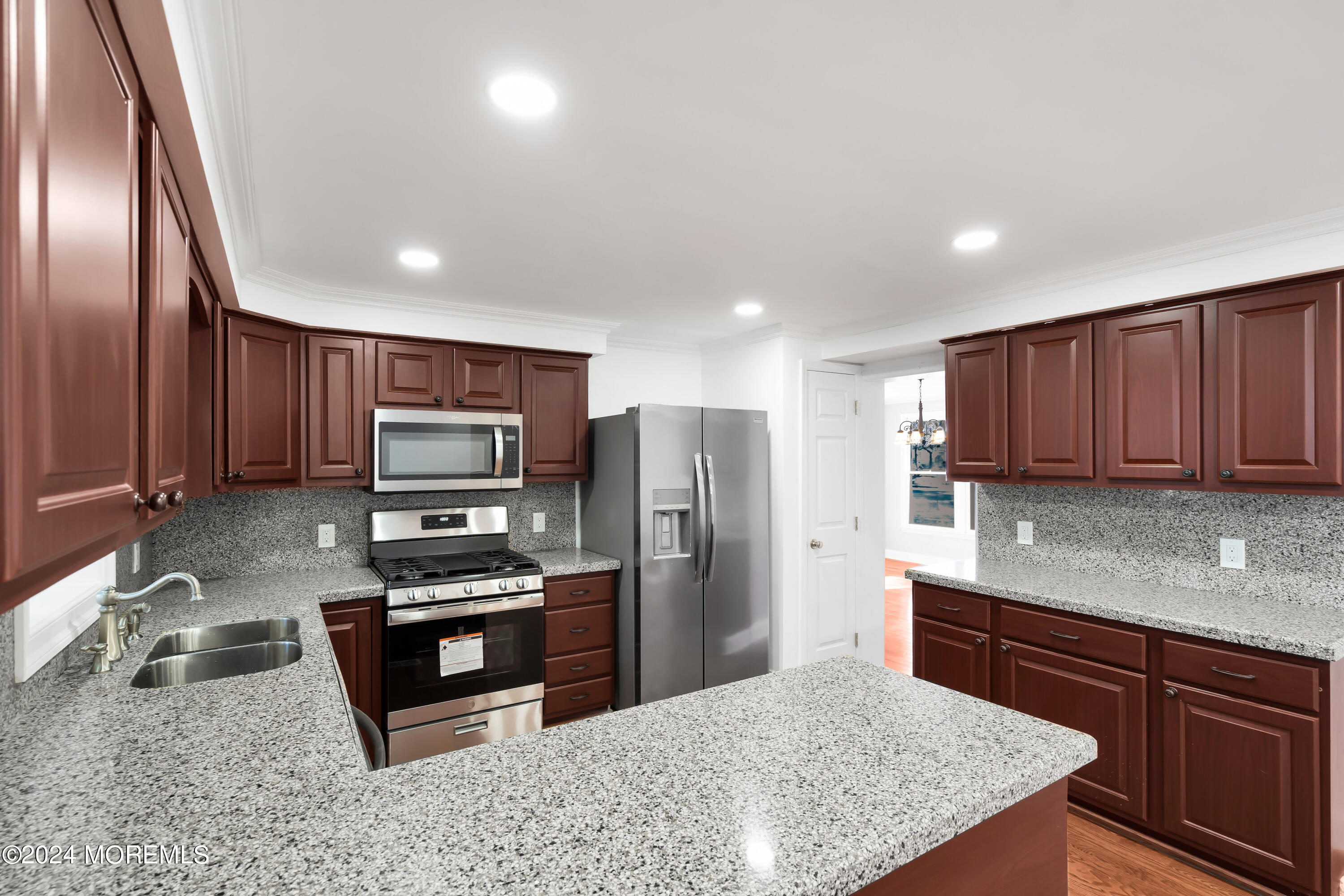 6 Afton Road Jackson, NJ 08527 - Photo 17 of 80 a kitchen with stainless steel appliances granite countertop a sink refrigerator and stove