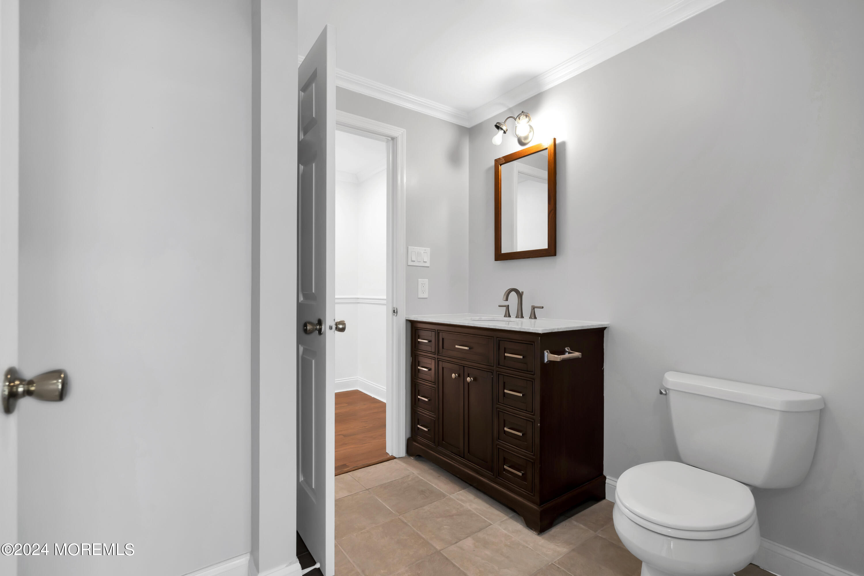 6 Afton Road Jackson, NJ 08527 - Photo 27 of 80 a bathroom with a toilet a sink and mirror