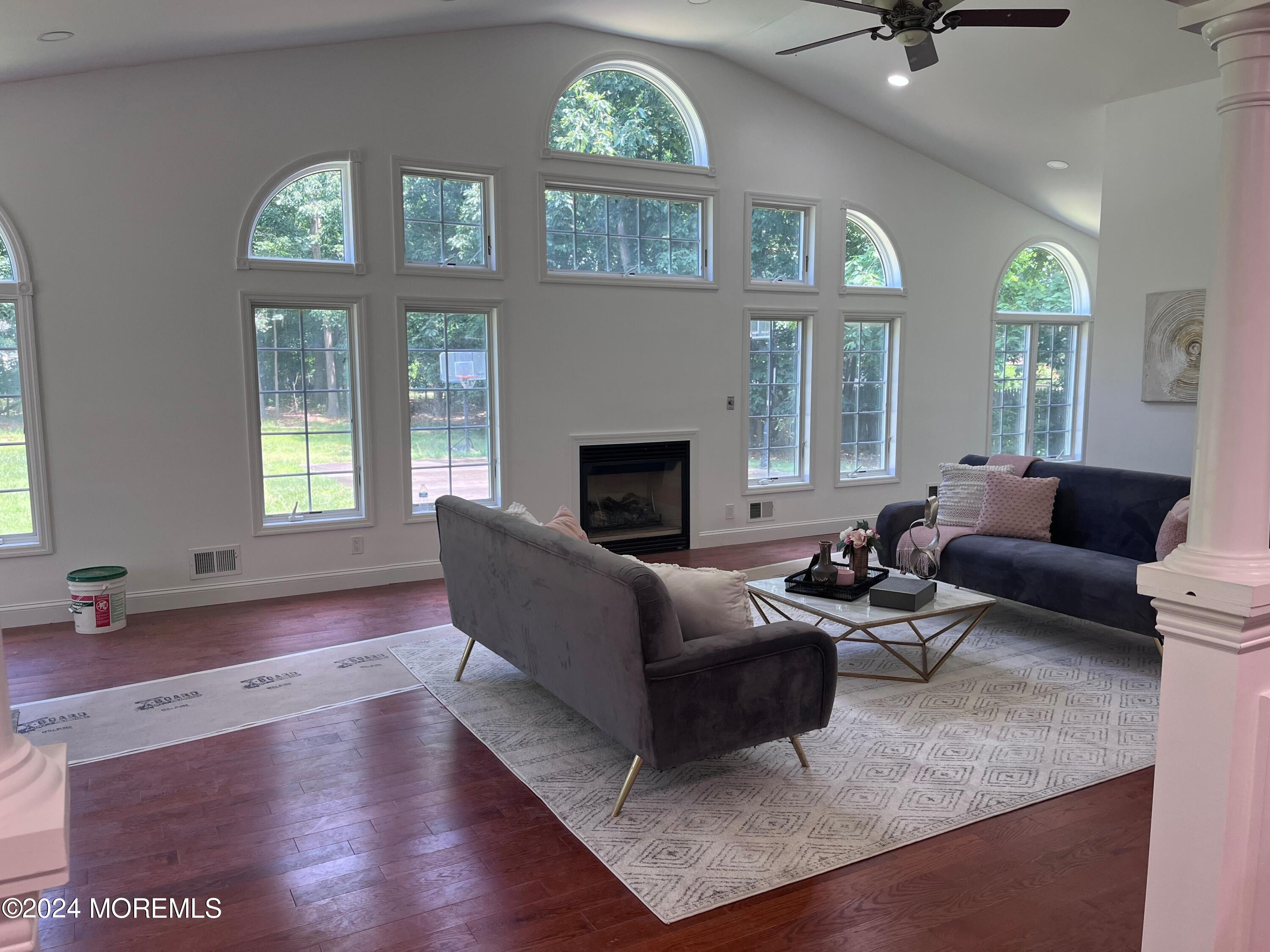 6 Afton Road Jackson, NJ 08527 - Photo 29 of 80 a living room with furniture and a fireplace