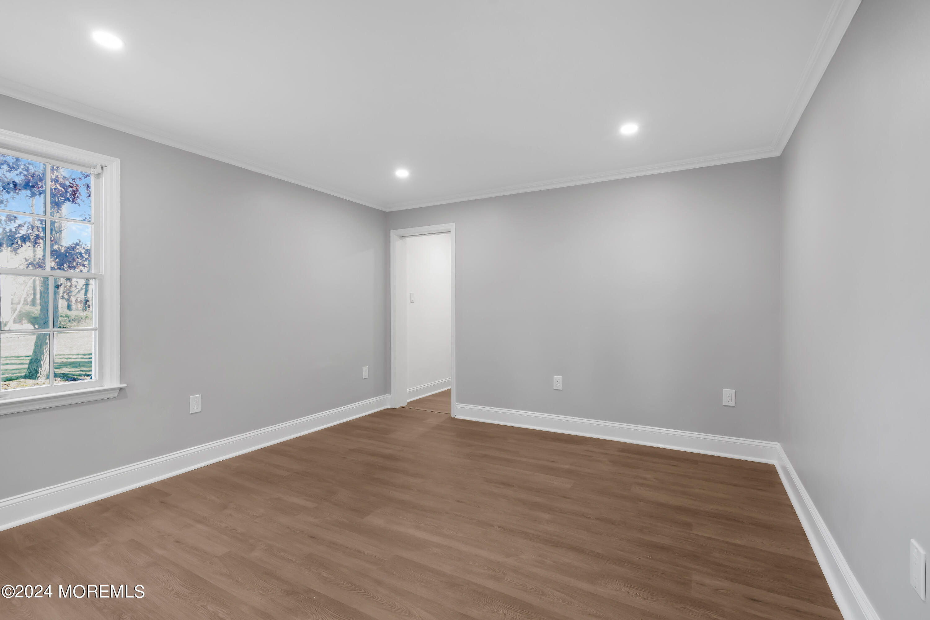 6 Afton Road Jackson, NJ 08527 - Photo 38 of 80 a view of an empty room with wooden floor and a window