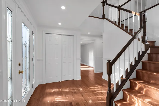a view of an entryway with wooden floor