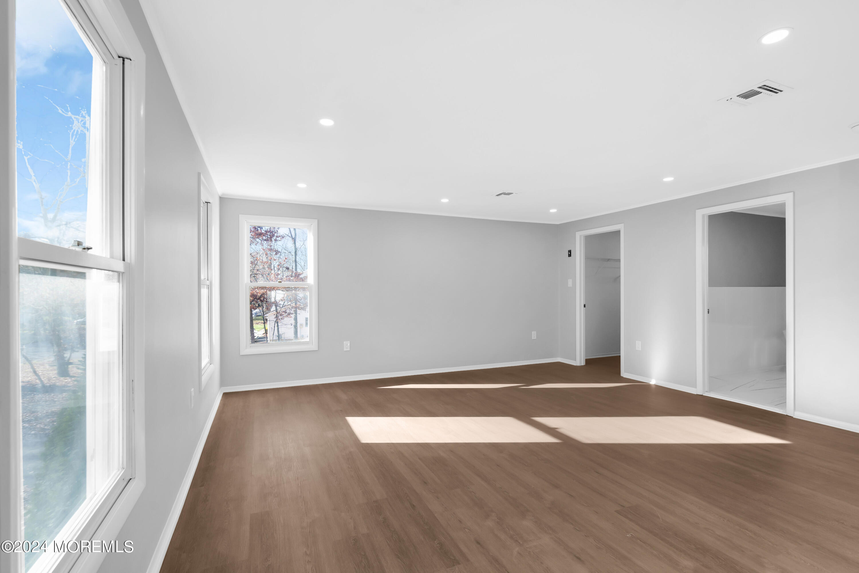 6 Afton Road Jackson, NJ 08527 - Photo 56 of 80 a view of an empty room with wooden floor and a window