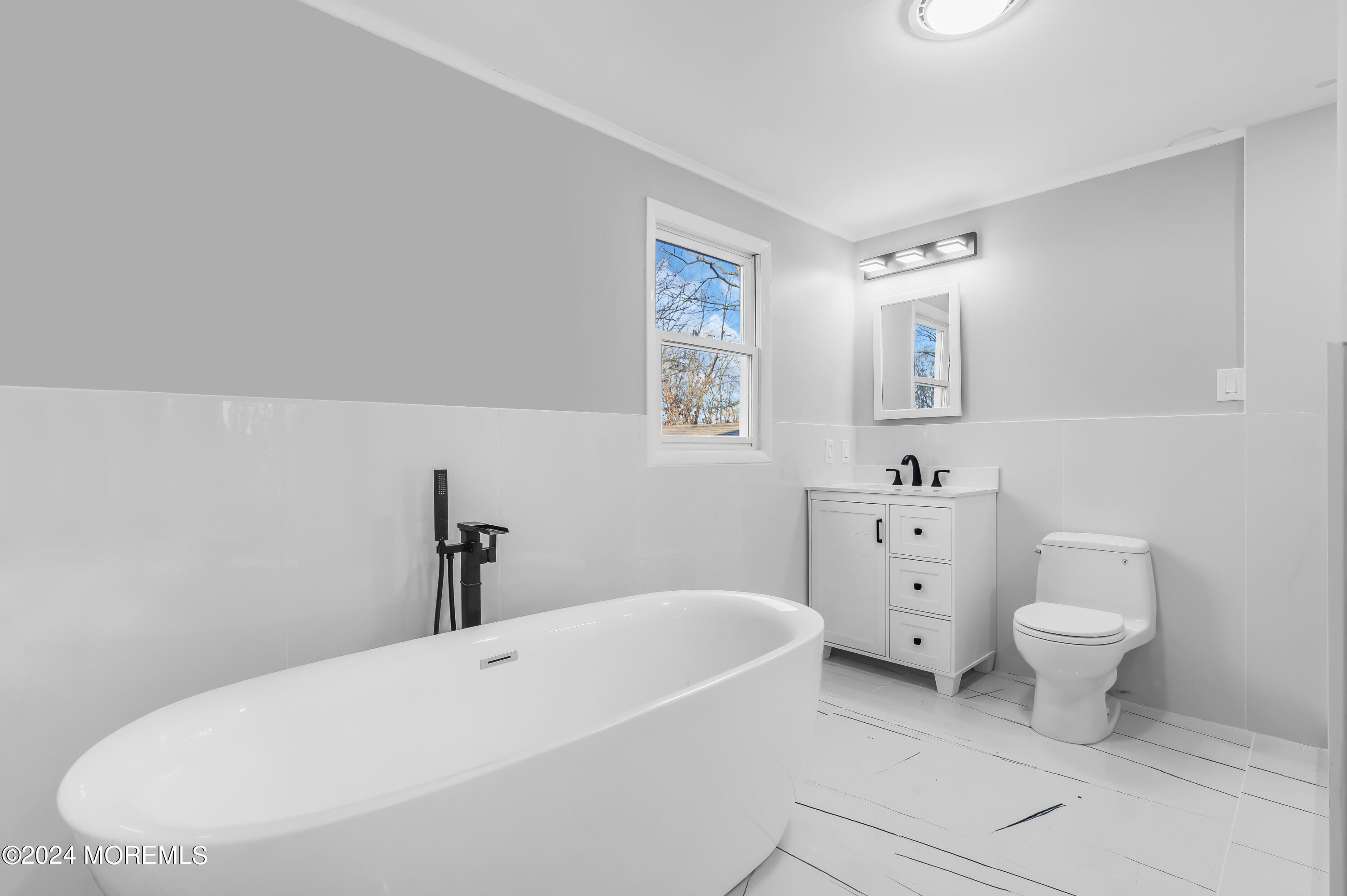 6 Afton Road Jackson, NJ 08527 - Photo 59 of 80 a bathroom with a toilet sink and mirror