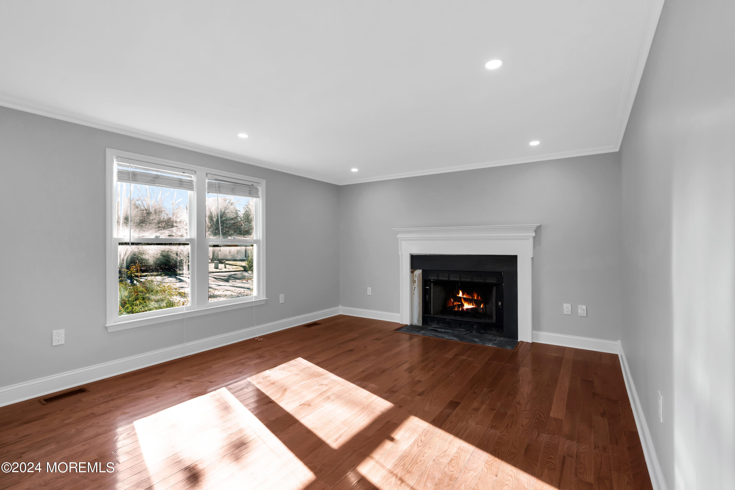 6 Afton Road Jackson, NJ 08527 - Photo 9 of 80 a view of an empty room with a window and fireplace