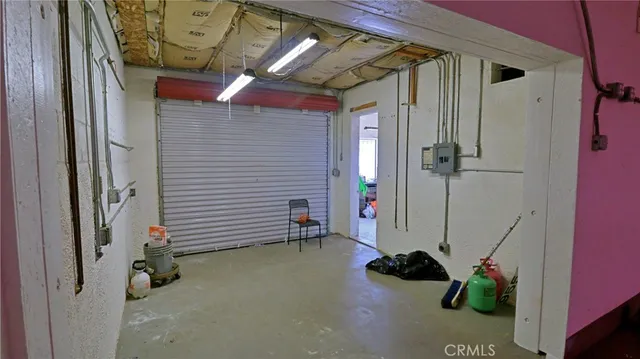 a view of a backyard with plants and a lake view