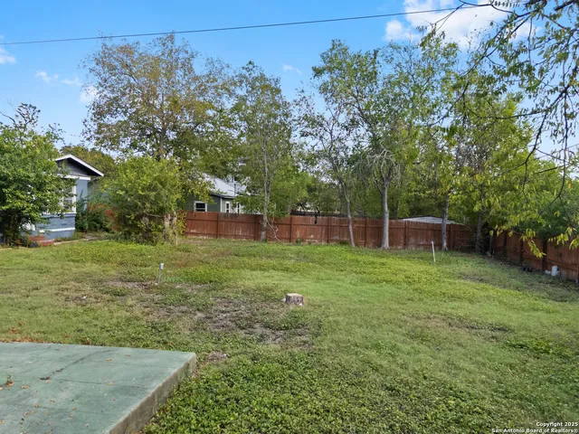 a backyard of a house with lots of green space
